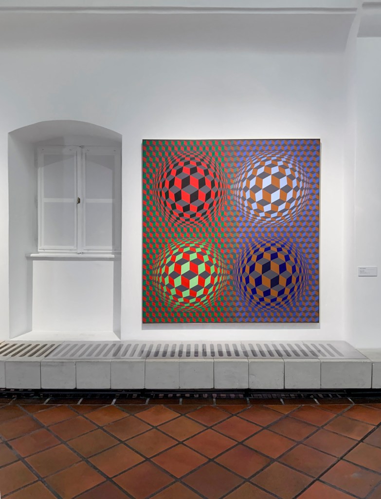 Installation view of the upstairs galleries of the Vasarely Museum, Budapest showing at right, 'Stri-oet' (1979)