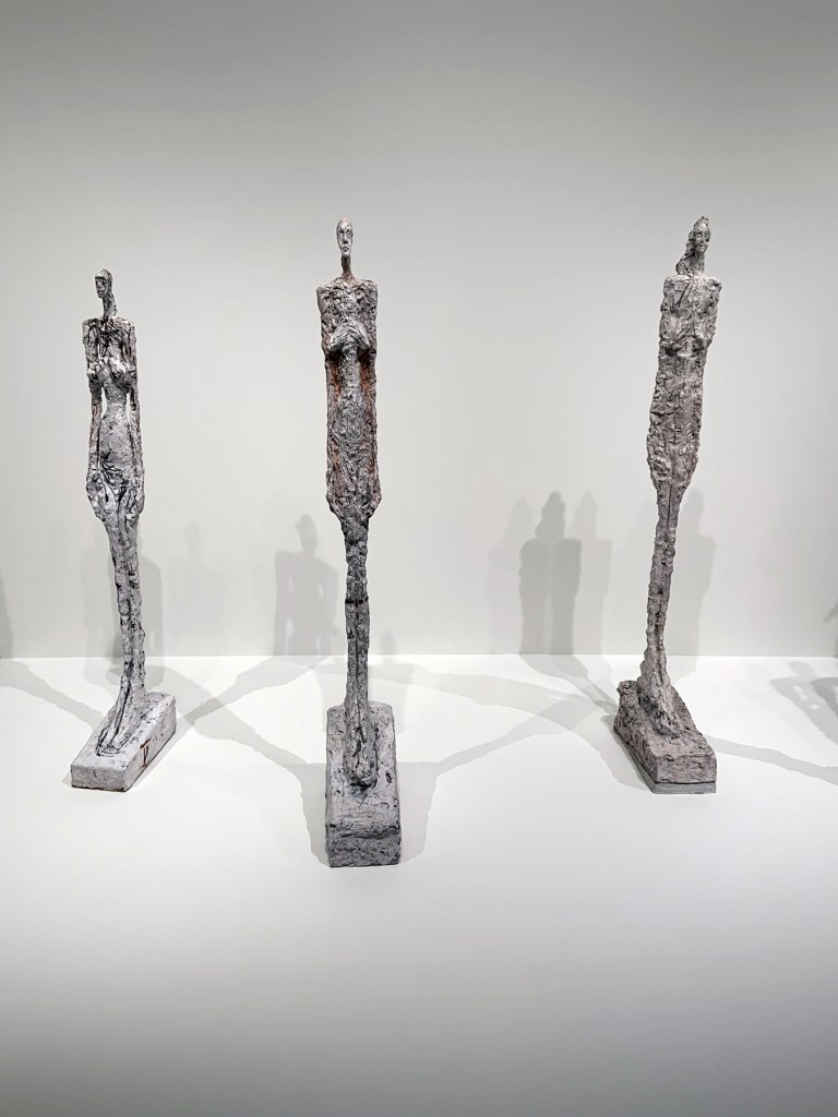 Installation view of the exhibition 'Alberto Giacometti' at the Trade Fair Palace, National Gallery Prague showing 'Women of Venice' 1956 (plaster and painted plaster, Fondation Giacometti, Paris)