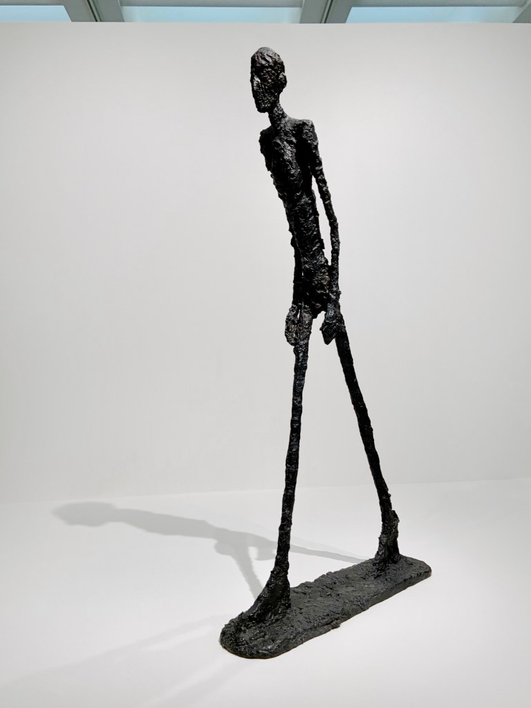Installation view of the exhibition 'Alberto Giacometti' at the Trade Fair Palace, National Gallery Prague showing 'Walking Man I' 1960