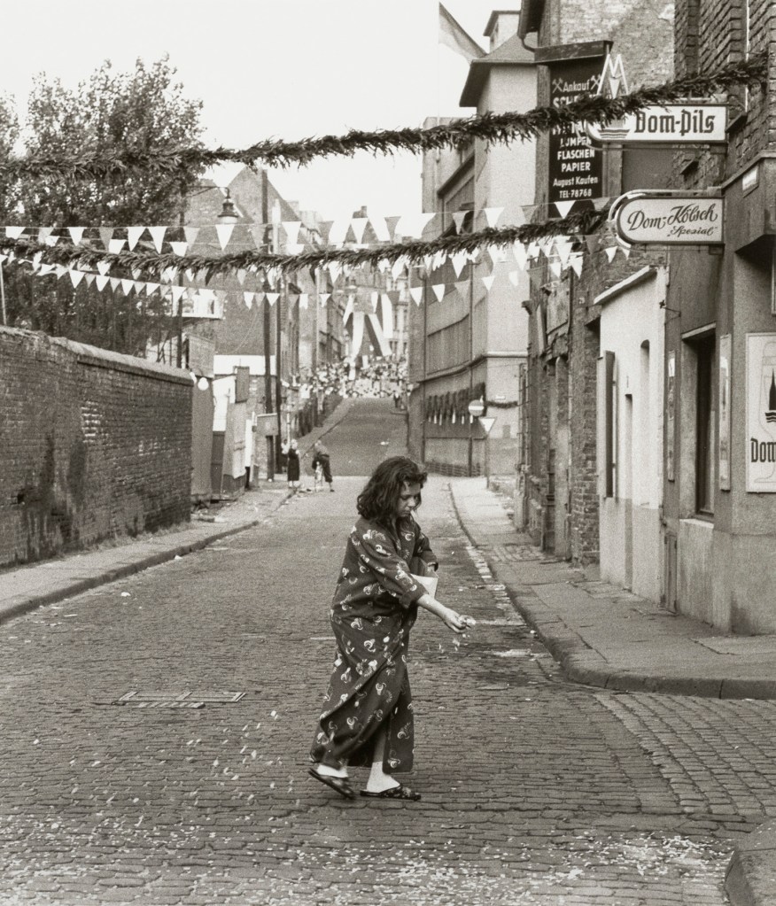 Chargesheimer (Karl-Heinz Hargesheimer) (German, 1924-1972) 'Untitled (girl scattering confetti)' c. 1956-1957