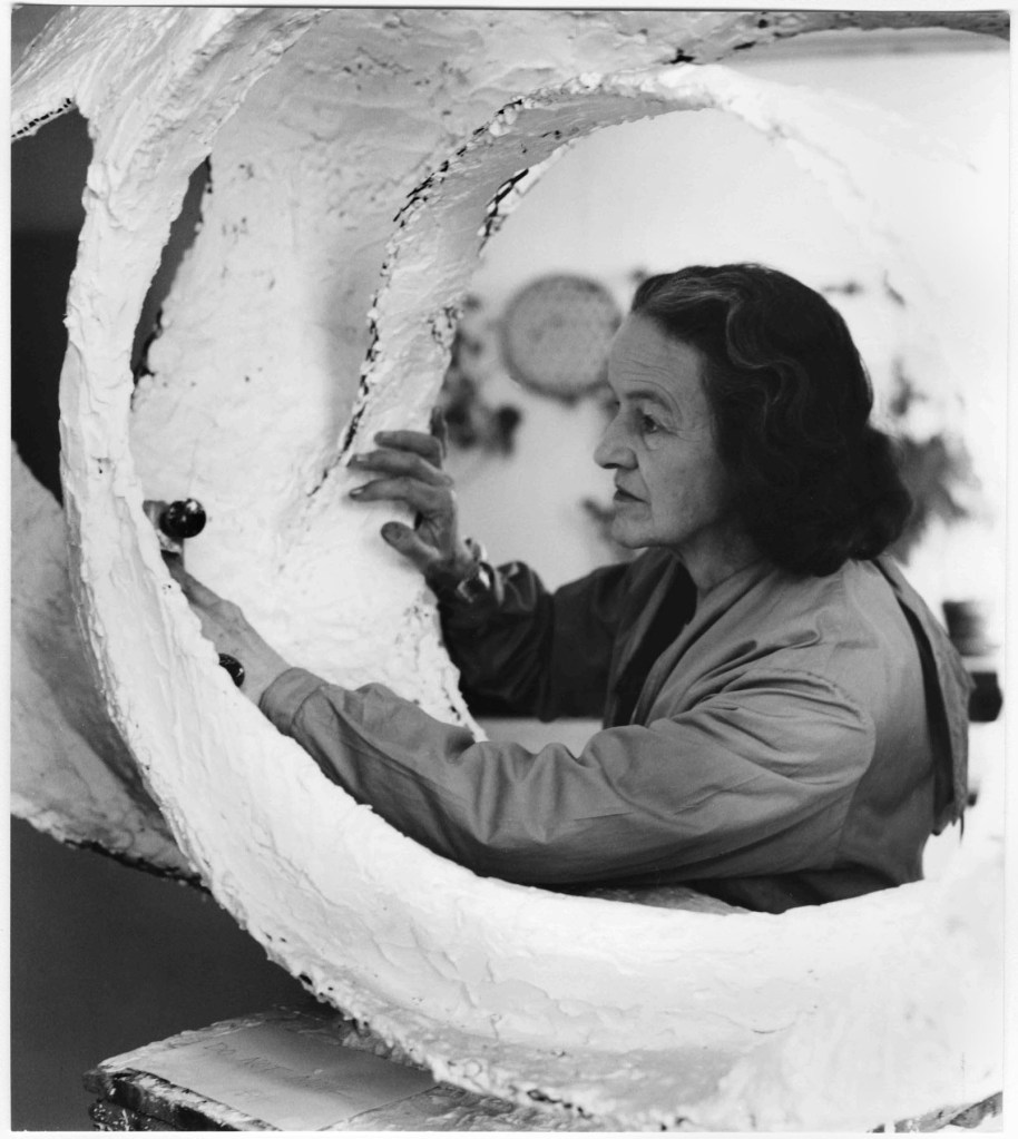 Barbara Hepworth at work on the plaster for 'Oval Form (Trezion)' 1963