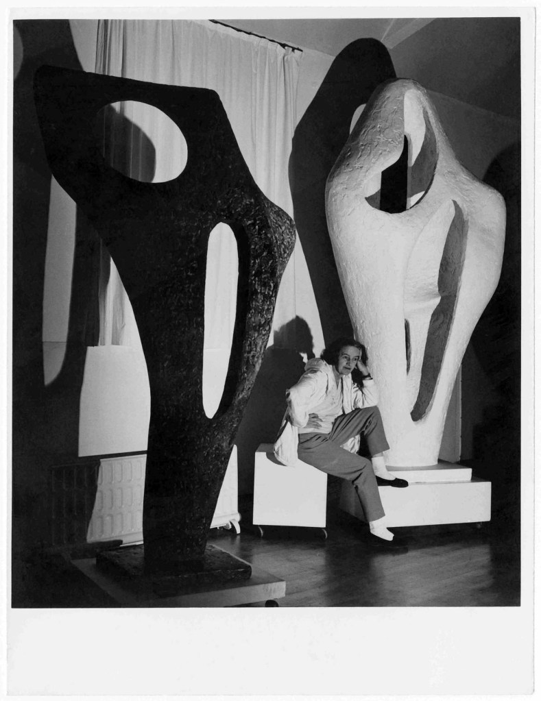 Barbara Hepworth with the Gift plaster of 'Figure for Landscape' and a bronze cast of 'Figure (Archaean)' November 1964