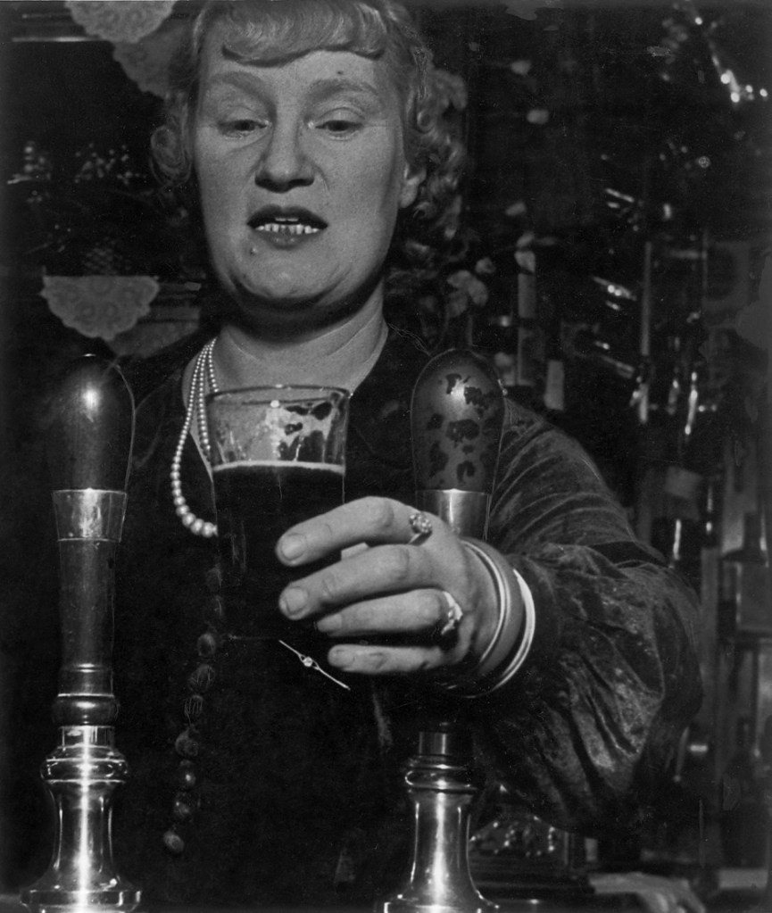 Bill Brandt (British born Germany, 1904-1983) 'Barmaid at the Crooked Billet, Tower Hill' March 1939