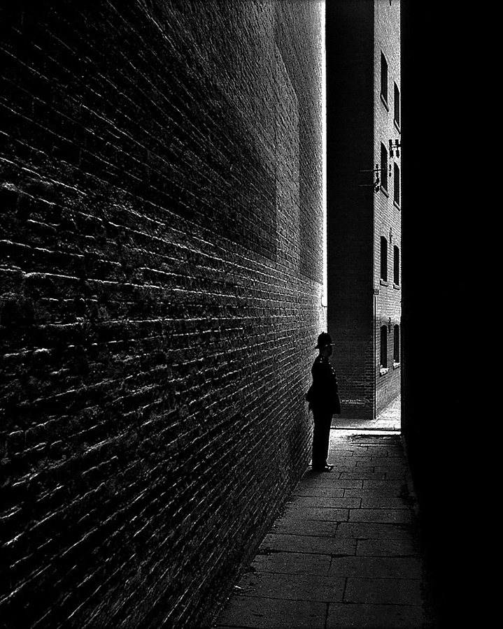 Bill Brandt (British born Germany, 1904-1983) 'Policeman in a Dockland Alley, Bermondsey' 1934