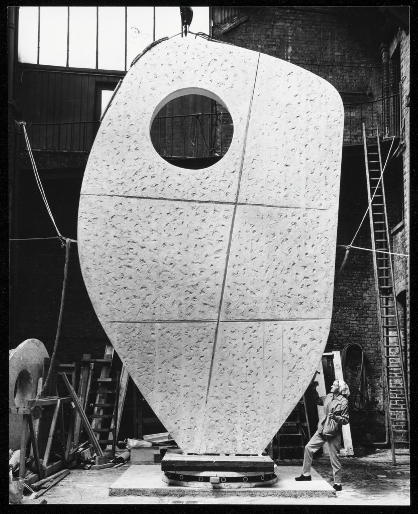 Barbara Hepworth with the plaster prototype for the United Nations 'Single Form' at the Morris Singer foundry, London May 1963
