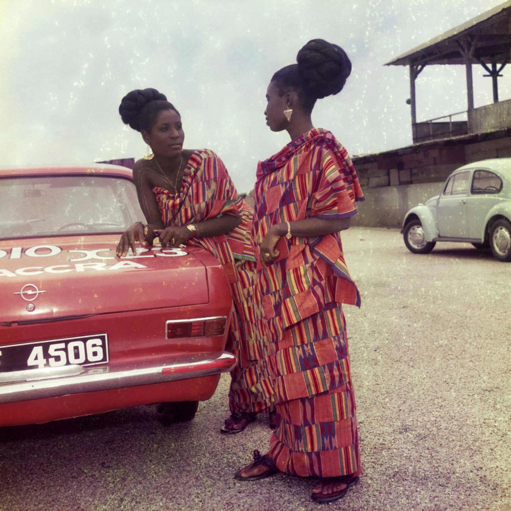 James Barnor (Ghanian, b. 1929) 'Two friends dressed for a church celebration with James' car, Accra' 1970