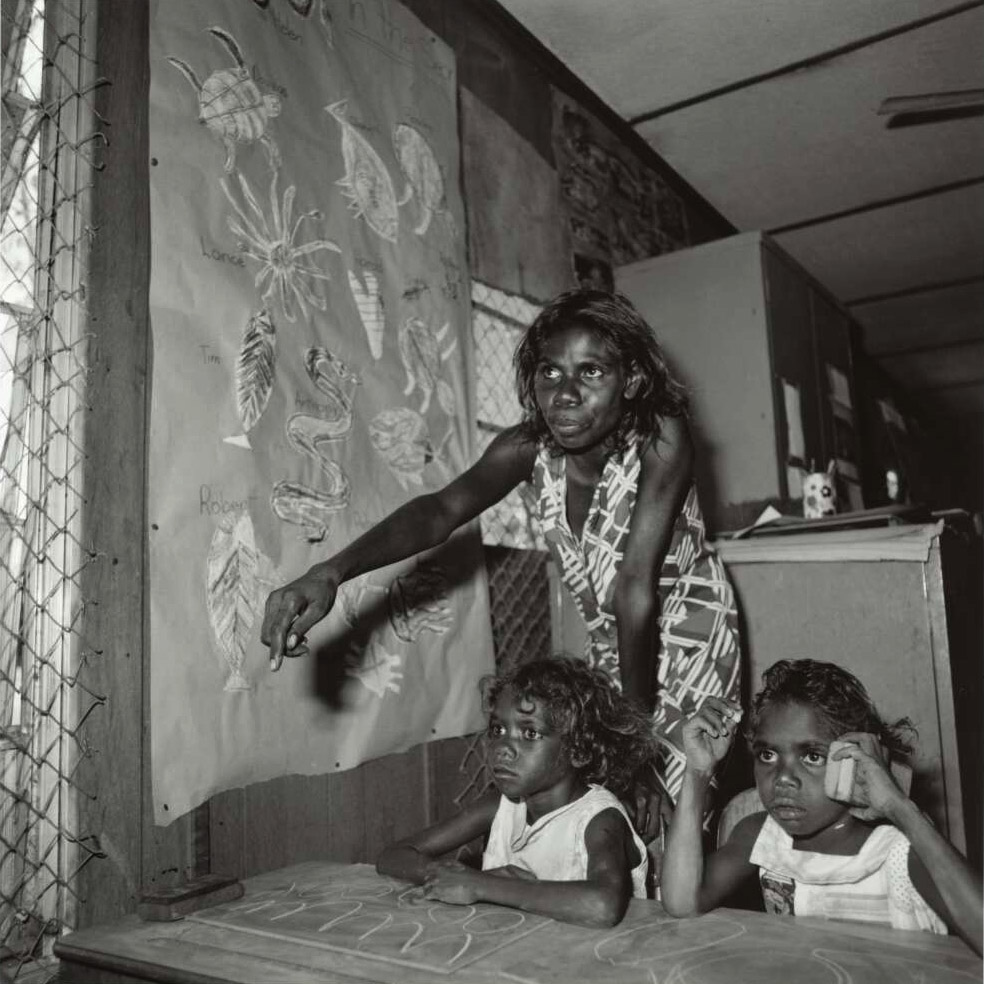 Mervyn Bishop (Australian, b. 1945) 'An Aboriginal school teacher and two children, Maningrida community, Arnhem Land, Northern Territory' 1975, reproduction 2014