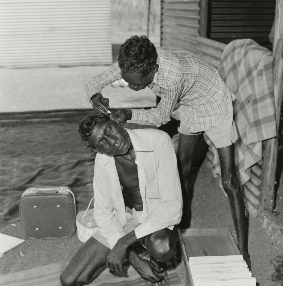 Mervyn Bishop (Australian, b. 1945) 'John Nykamula treating patient Gurrumuru Mala, Arnhemland, Northern Territory' 1975, reproduction 2014