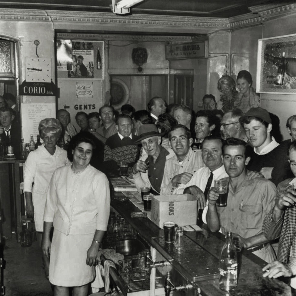Mervyn Bishop (Australian, b. 1945) 'Patrons drinking at a pub on the eve of its closure, Glebe, New South Wales' 1967, reproduction 2014