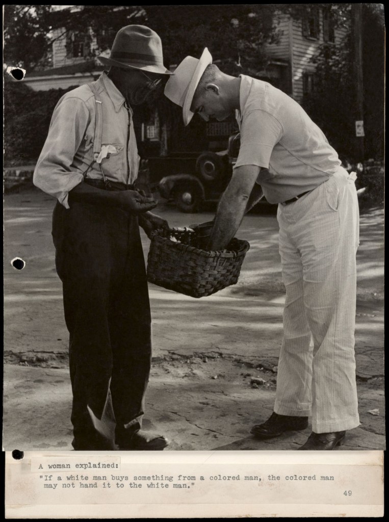 Marion Palfi (American born Germany, 1907-1978) 'Untitled (A woman explained: "If a white man buys something...")' 1949