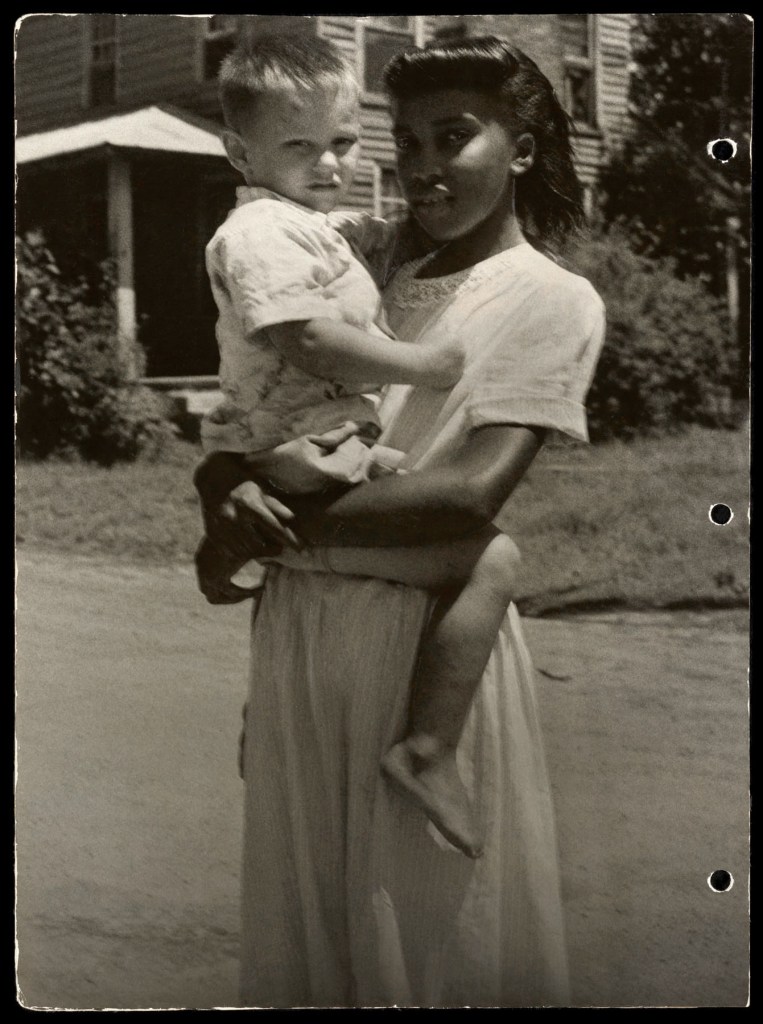 Marion Palfi (American born Germany, 1907-1978) 'Untitled (Black woman with a white child)' 1949