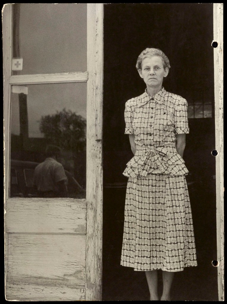 Marion Palfi (American born Germany, 1907-1978) 'Untitled (Woman in a patterned summer suit)' 1949