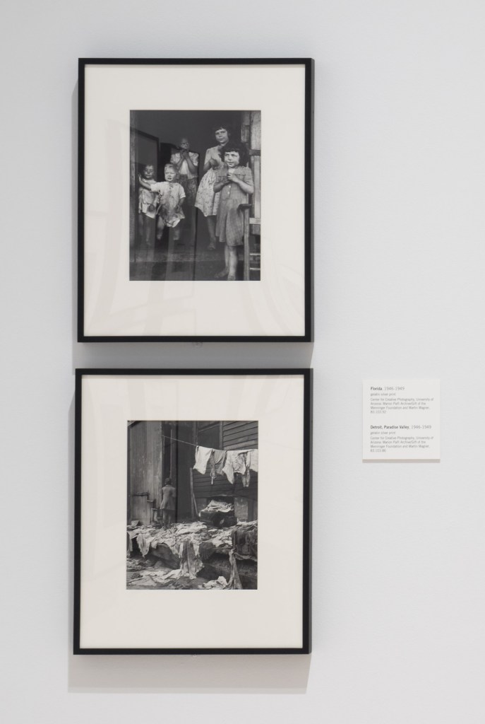 Installation view of 'Freedom Must Be Lived: Marion Palfi's America, 1940-1978', 2021, Phoenix Art Museum showing at top, 'Florida' 1946-1949; and at bottom, 'Detroit, Paradise Valley' 1946-1949