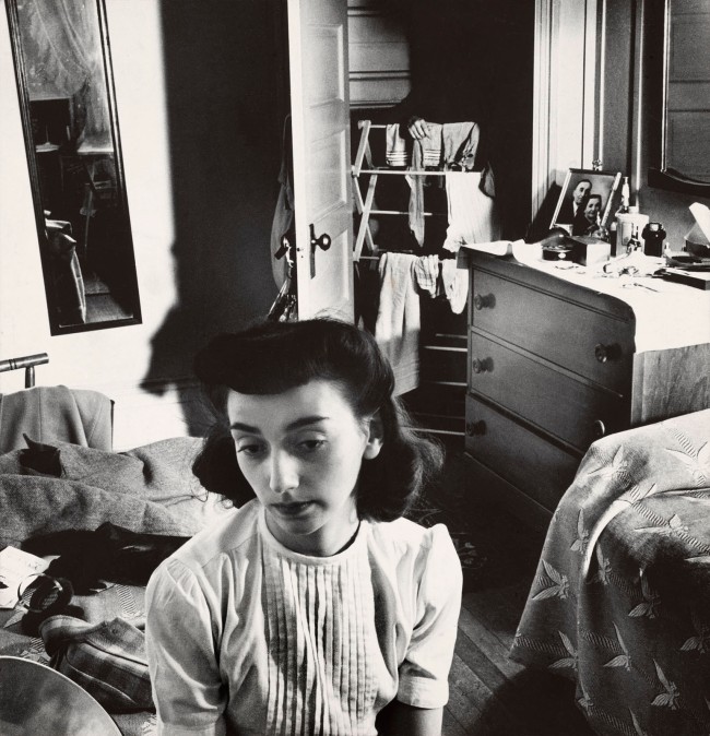 Esther Bubley (American, 1921-1998) 'Young woman in the doorway of her room at a boardinghouse, Washington, DC' 1943