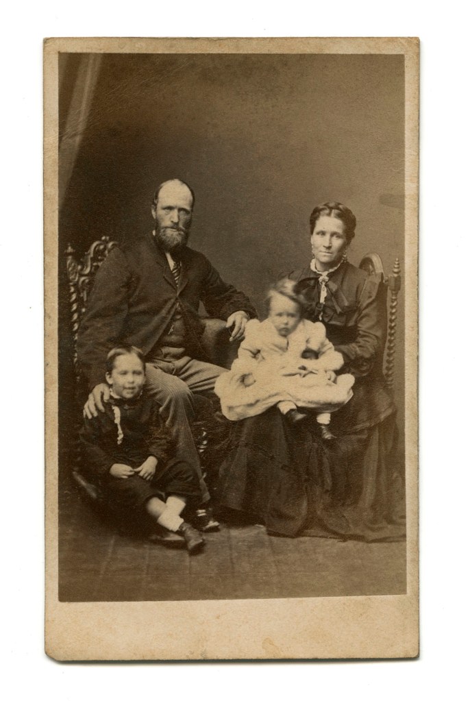 E. E. Hibling (photographer active c. 1873 - c. 1877) Johnstone O'Shannessy & Co (active 1865-1905) 'Untitled (family group)' c. 1873 - c. 1877 (recto)