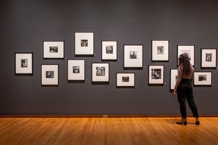 Installation view of the exhibition 'Imogen Cunningham: A Retrospective' at the Seattle Art Museum (SAM) showing No. 7: Double Image, Sutter St. and Fillmore (c. 1940); 8: Under the Queensboro Bridge, 1934; 9: Sunbonnet Lady, Fillmore Street, San Francisco (c. 1950s); 10: Self-portrait in Copenhagen, 1961; 11: Leni in Chartres, 1960; 14: Reeds, 1952; 15: Me Too, 1955