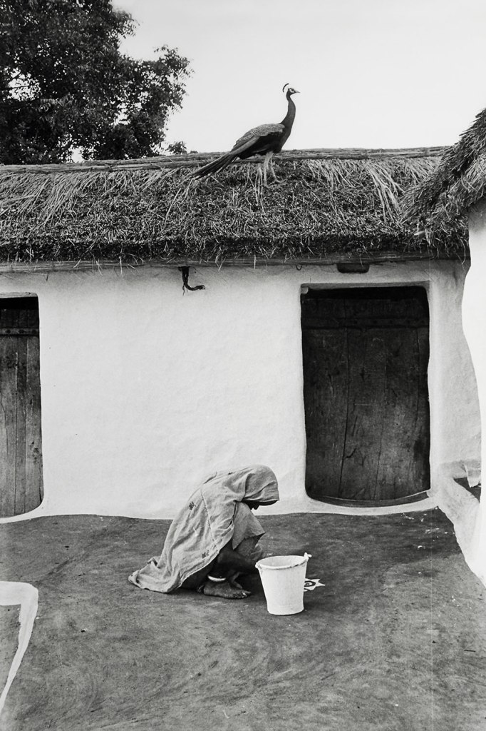 Jyoti Bhatt (Indian, b. 1934) 'An old woman making/drawing a mandana (Rangoli) design, Rajasthan' 1972