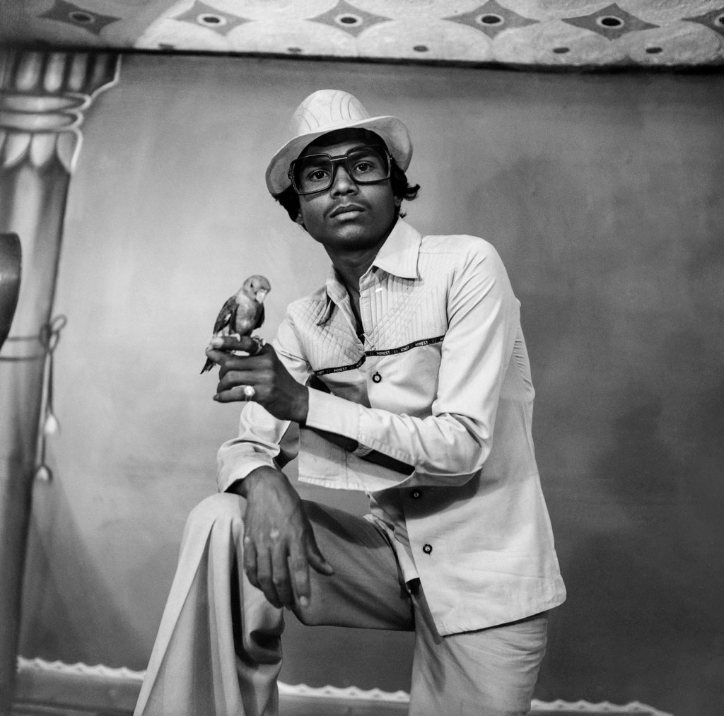 Suresh Punjabi (Indian, b. 1957) 'Untitled (Portrait of a man holding a bird), Suhag Studio, Nagda, Madhya Pradesh' 1987