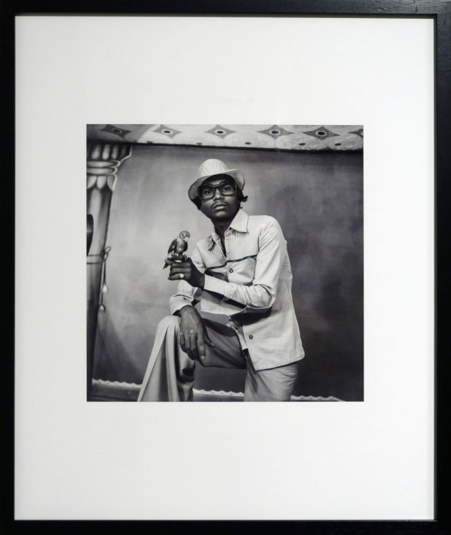 Suresh Punjabi (Indian, b. 1957) 'Untitled (Portrait of a man holding a bird), Suhag Studio, Nagda, Madhya Pradesh' 1987 (installation view)