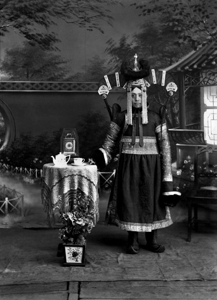 Unknown photographer. 'Untitled [Mongolian woman with clock]' 1910s-1920s