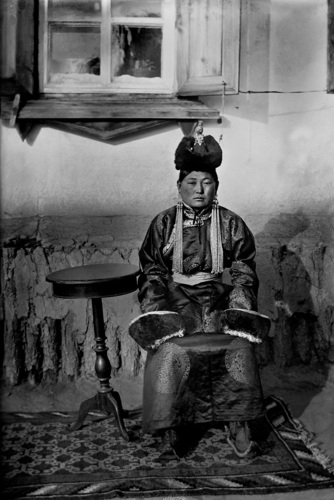 Unknown photographer. 'Untitled [Mongolian woman and table]' 1910s-1920s