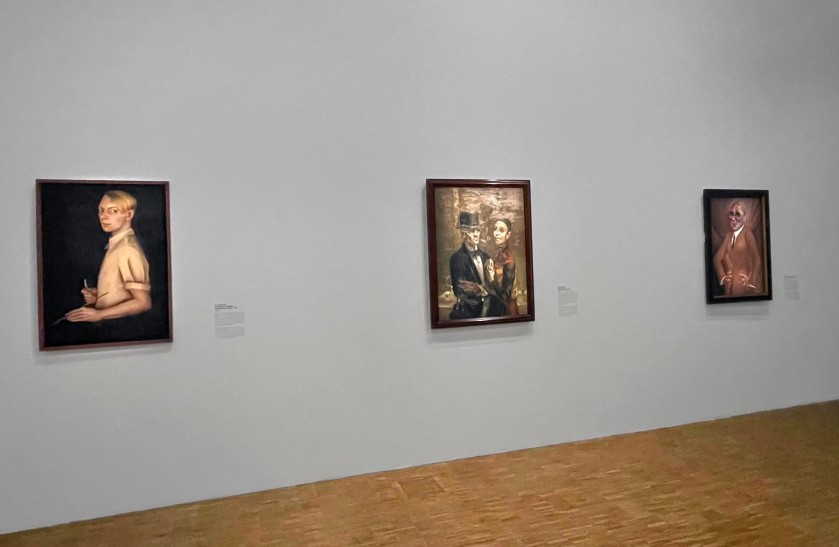Installation view of the exhibition 'Germany / 1920s / New Objectivity / August Sander' at Centre Pompidou, Paris showing at left, Kate Diehn-Bitt's 'Self Portrait as an Artist' (1935); at middle, Gert Wollheim's 'Untitled (Couple)' (1926); and at right, Otto Dix's 'Portrait of the Jeweller Karl Krall' (1923)