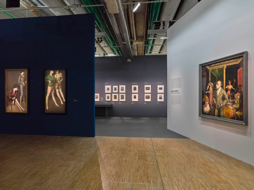 Installation view of the exhibition 'Germany / 1920s / New Objectivity / August Sander' at Centre Pompidou, Paris showing at left, Karl Hubbuch's 'Twice Hilde II and Twice Hilde' (c. 1929); and at right, Otto Dix's 'An die Schönheit (Selbstbildnis)' (To the beauty (Selfportrait)) (1922)