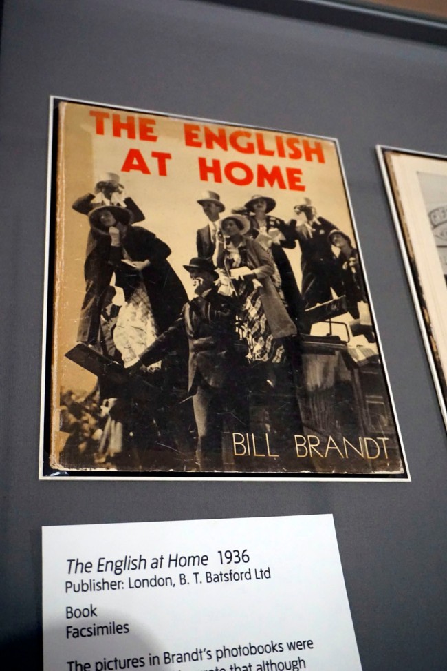 Installation views of the exhibition 'Bill Brandt: Inside the Mirror' at Tate Britain, London, October 2022 - January 2023 showing the cover and pages from Brandt's photobook 'The English At Home' (1936)