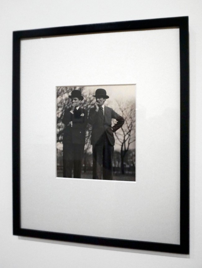 Installation view of the exhibition 'Bill Brandt: Inside the Mirror' at Tate Britain, London, October 2022 - January 2023 showing Brandt's photograph 'Race Goers, Auteuil Races, Paris' (1931)