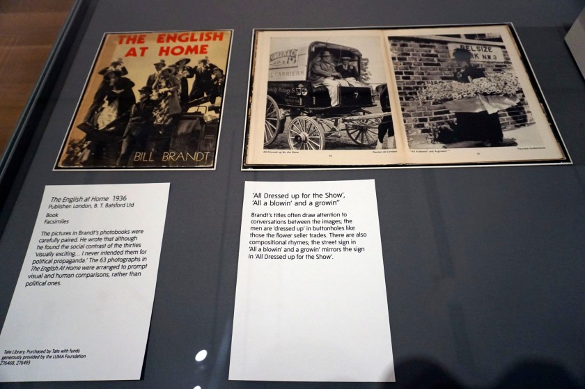 Installation views of the exhibition 'Bill Brandt: Inside the Mirror' at Tate Britain, London, October 2022 - January 2023 showing the cover and pages from Brandt's photobook 'The English At Home' (1936)
