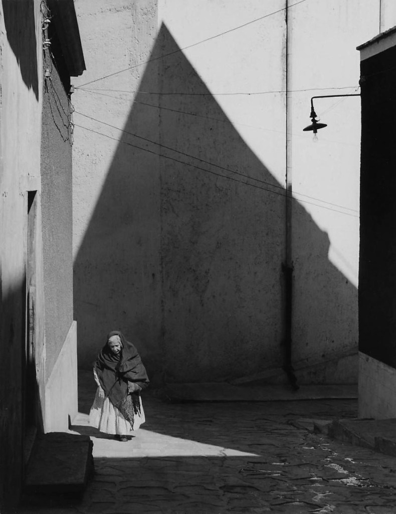 Manuel Carrillo (Mexican, 1906-1989) 'Untitled (Old lady, alley, pyramidal shadows, Guanajuato)' (Sin título (Viejita, callejón, sombras piramidales, Guanajuato)) Nd