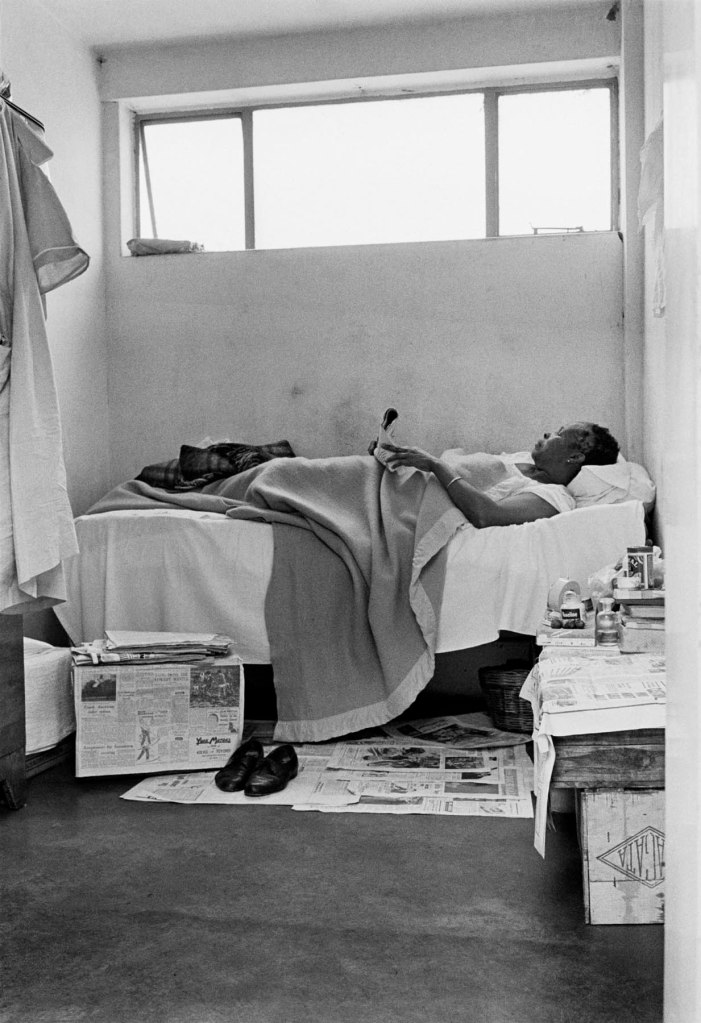 Ernest Cole (South African, 1940-1990) 'Newspapers are her carpet, fruit crates her chairs and table' 1960-1966