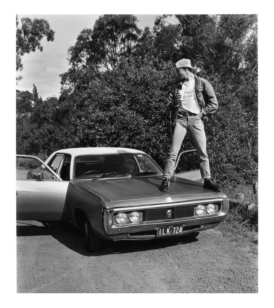 Marcus Bunyan (Australian born England, b. 1958) 'Jeff standing on his Chrysler, Studley Park, Melbourne, Victoria, 1992' 1992