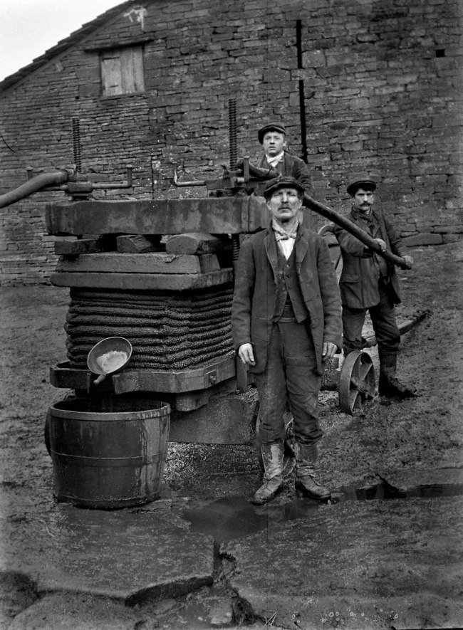 Richard Jenkins (British, 1890-1964) 'Untitled [Three men and a press]' Nd