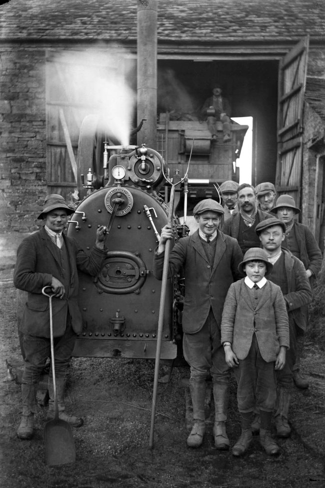 Richard Jenkins (British, 1890-1964) 'Untitled [Group of men with Romford & Evershed Ltd Pershorf 1885 steam engine]' Nd