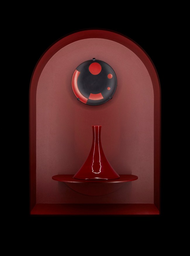 Installation view of the exhibition '1,001 Remarkable Objects' at Powerhouse Ultimo, Sydney showing at top, El Lissitzky's 'Plate' (c. 1923); and at bottom, Christopher Dresser's 'Vase' (c. 1888)