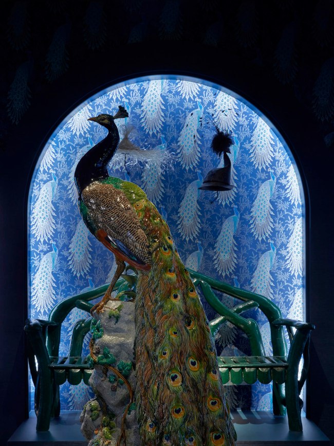 Installation view detail of the exhibition '1,001 Remarkable Objects' at Powerhouse Ultimo, Sydney showing in the foreground, Figure, 'Peacock', earthenware with majolica glazes, modelled by Paul Comolera, made by Mintons, Stoke-on-Trent, Staffordshire, England, c. 1873-1875