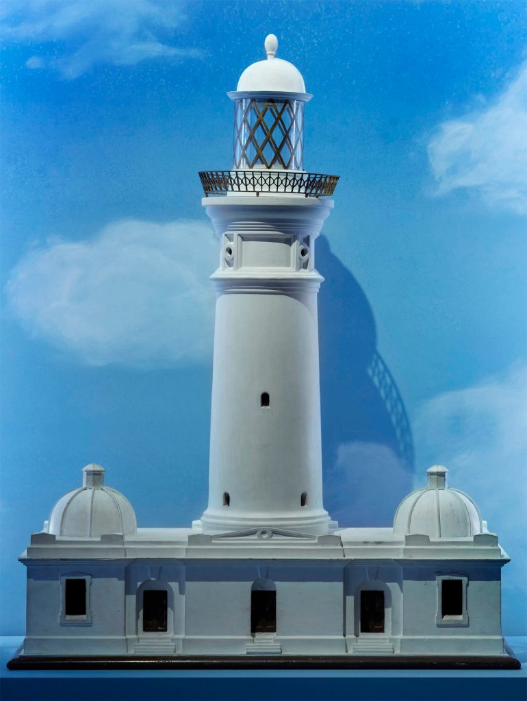Installation view detail of the exhibition '1,001 Remarkable Objects' at Powerhouse Ultimo, Sydney showing at centre an architectural model of the Macquarie Lighthouse made by the Department of Navigation, Sydney, New South Wales, Australia, c. 1880