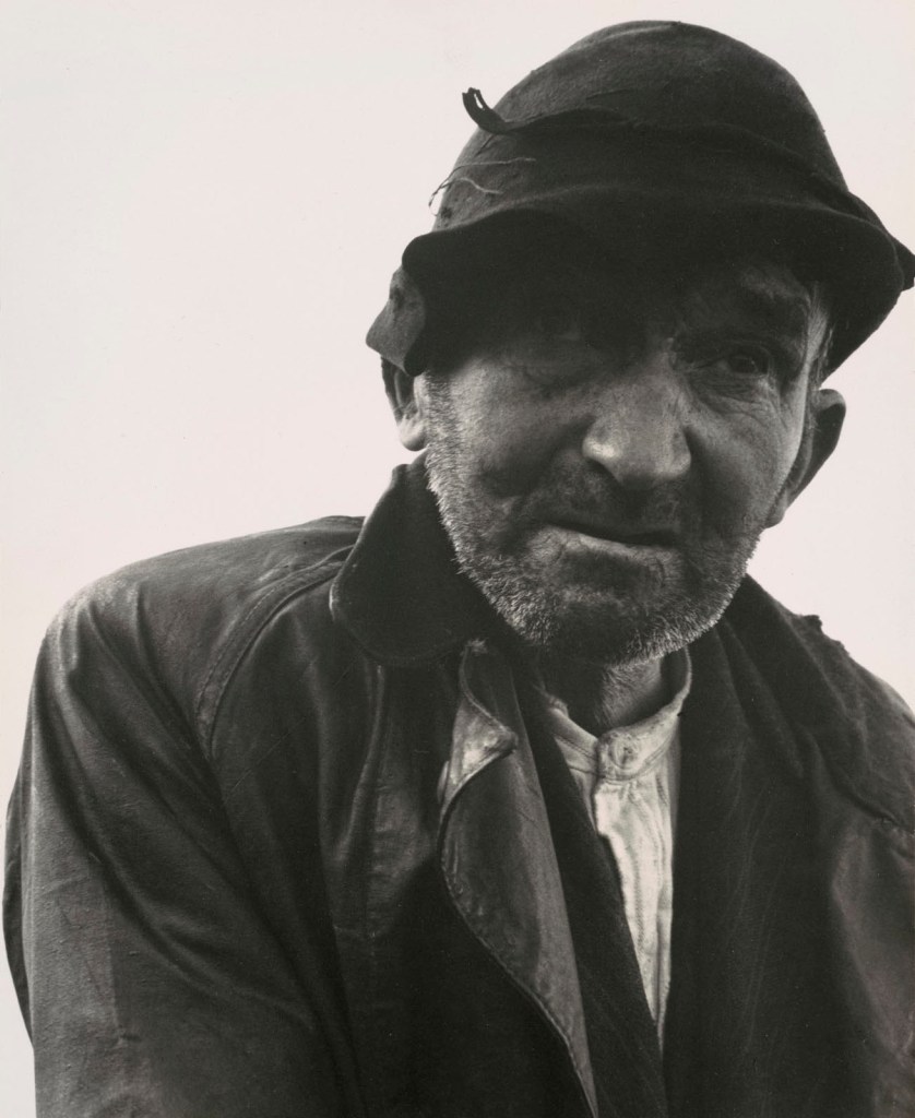 Dorothea Lange (American, 1895-1965) 'Man Walking Down a Country Road from the Kenneally Family Farm, County Clare, Ireland' from 'The Irish Countryman' 1954