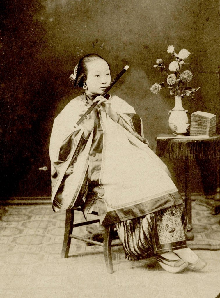 Unidentified Photographer in China. 'Portrait of a Woman Playing a Dizi' 1870s