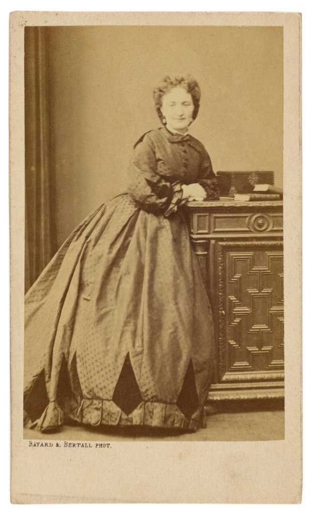 Hippolyte Bayard (French, 1801-1887) '[Unidentified woman standing, leaning against a credenza]' about 1861