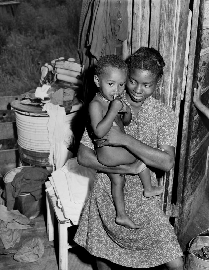 Russell Lee (American, 1903-1986) 'There are ten children in the Lawson Mayo family, the older taking care of the youngest ones. Three of the daughters are now attending high school in Mullens and have part time jobs during summer months. Mullens Smokeless Coal Company, Mullens Mine, Harmco, Wyoming County, West Virginia' (Original Caption) August 23, 1946
