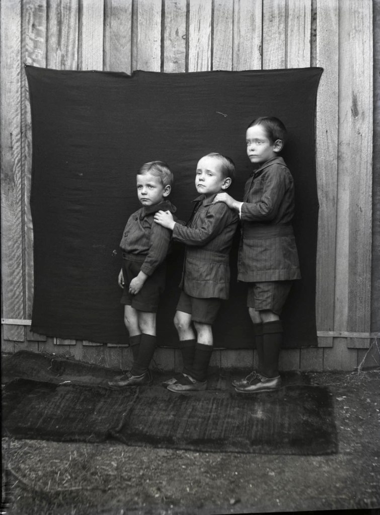 Oliver Emery, Sydney (Australian) '[Three boys posed outside against a makeshift backdrop]' c. 1914-1930