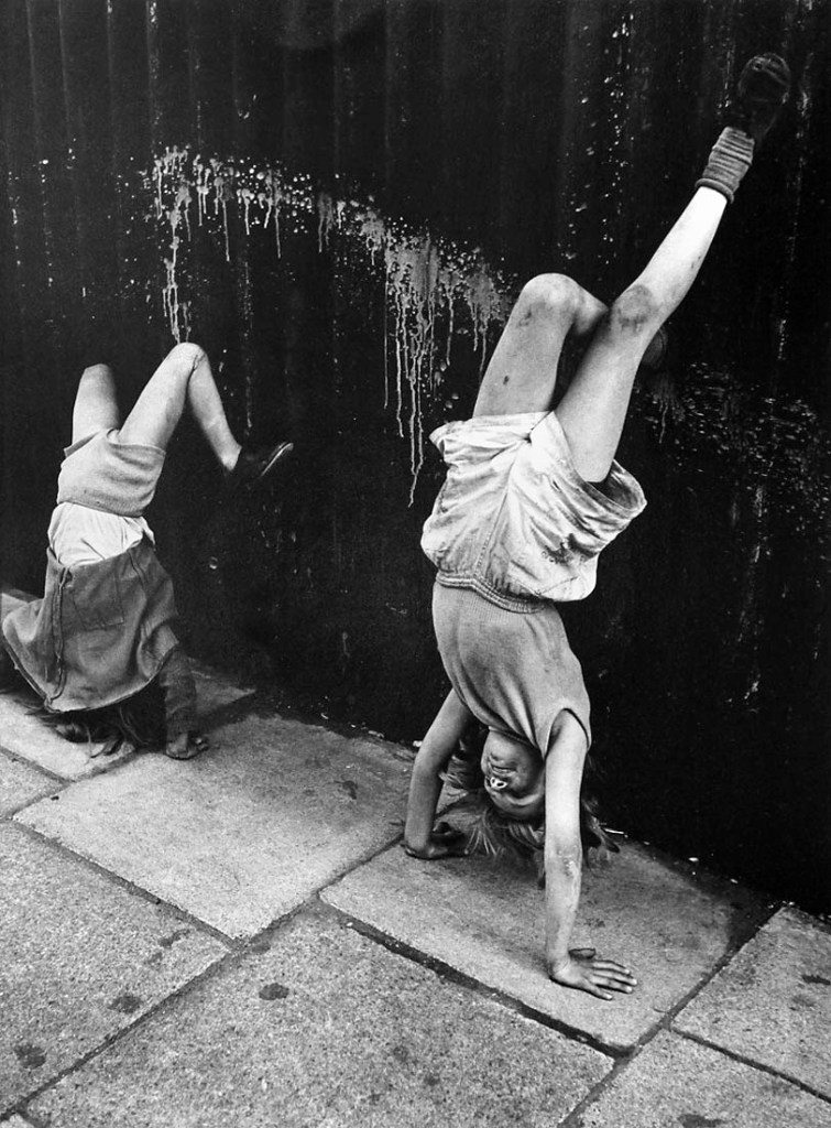 Roger Mayne (British, 1929-2014) 'Girls doing a Handstand, Southam Street' 1956