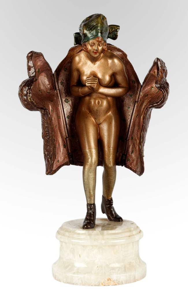 Bruno Zach (Austrian born Ukraine, 1891-1935) (designer) 'Figure of a woman with a fur coat' c. 1920