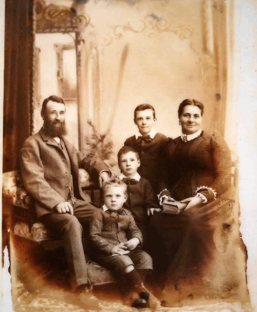 Elite Photographers. 'Portrait of the Thompson family, with drawn-on eyes and eyebrows' 1893