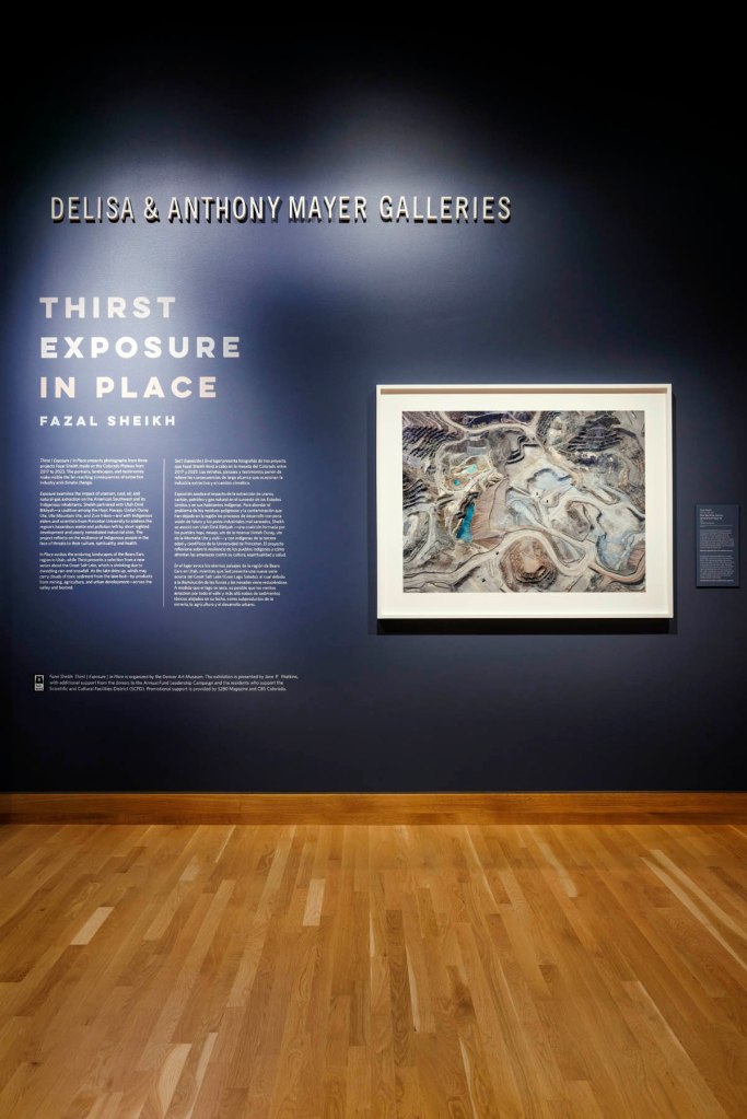 Installation view of the exhibition 'Fazal Sheikh: Thirst | Exposure | In Place' at the Denver Art Museum showing the opening wall text