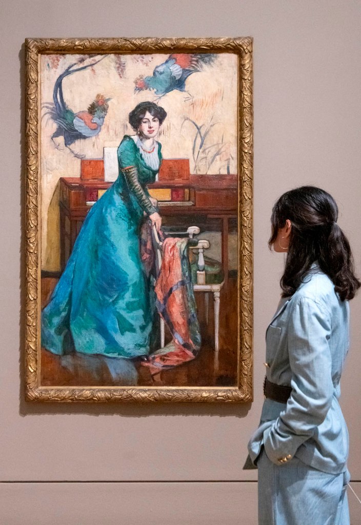 Installation view of the exhibition 'Now You See Us Women Artists in Britain 1520-1920' at Tate Britain showing Ethel Wright's 'The Music Room, Portrait of Una Dugdale' 1912