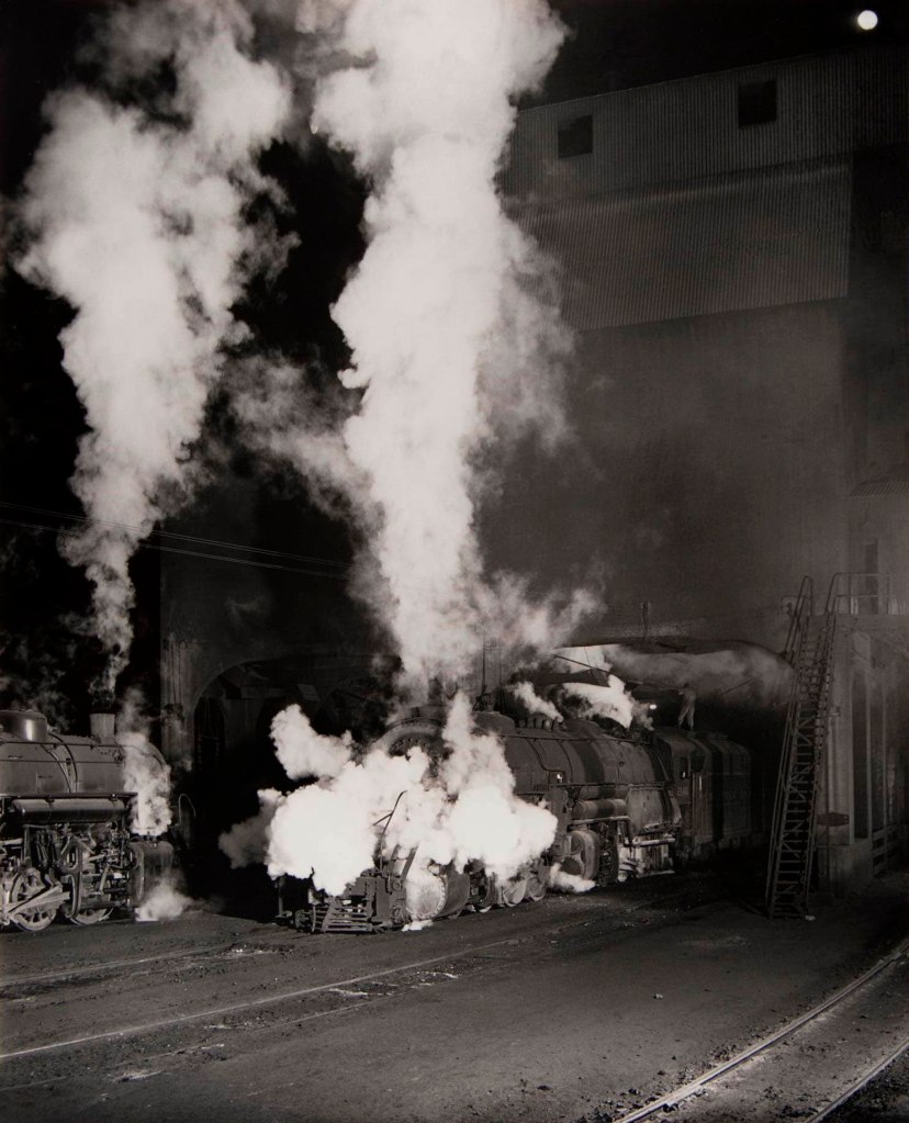 O. Winston Link (American, 1914-2001) 'Coaling Locomotives, (Puff of Steam) Shaffers Crossing Yards, Roanoke, Virginia' 1955