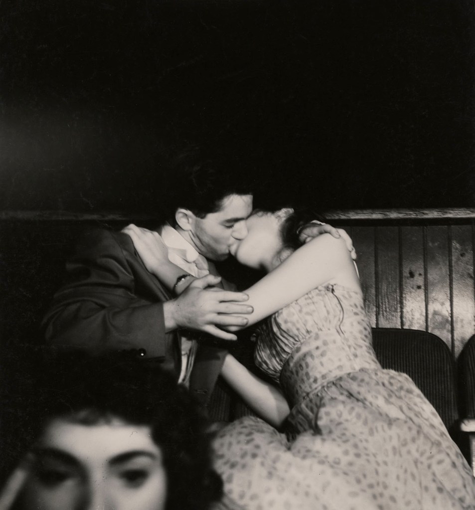 Weegee (Arthur Fellig) (American born Ukraine, 1899-1968) '[Lovers at the movies, New York]' c. 1943